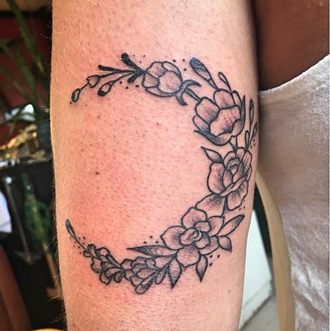 Crescent moon made of flowers tattoo by Kc Carew at Gold Standard Tattoo in Bend, OR.