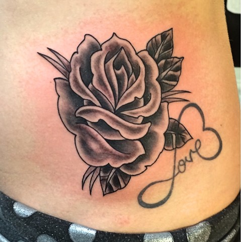 Black and grey American Traditional rose by Dirk Spece at Gold Standard Tattoo in Bend, OR.