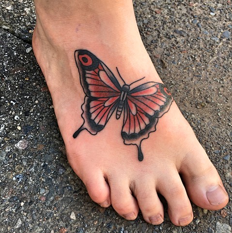 Butterfly foot tattoo by Kc Carew at Gold Standard Tattoo in Bend, OR.