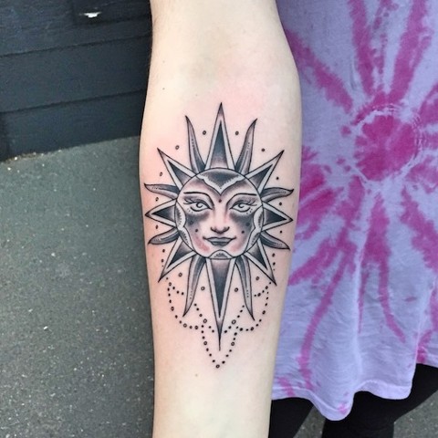 Black and grey sun tattoo by Dirk Spece at Gold Standard Tattoo in Bend, OR.