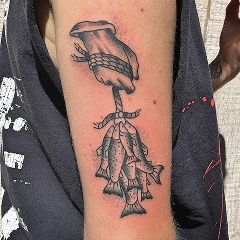 Hand and fishes tattoo by Kc Carew at Gold Standard Tattoo in Bend, OR.