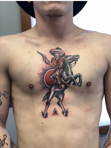 Cowgirl on a horse at sunset tattoo by Kc Carew at Gold Standard Tattoo in Bend, Oregon