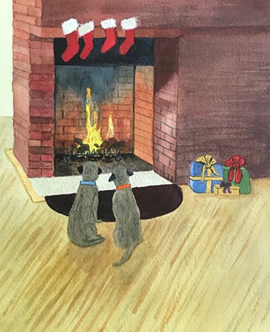 Two little terrier pups sit in front of a roaring fireplace.