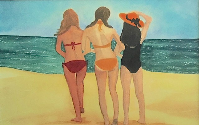 Three best girlfriends stroll on the beach, arm in arm.