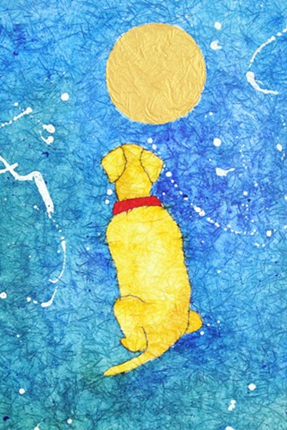 A yellow labrador retriever sits by a golden moon