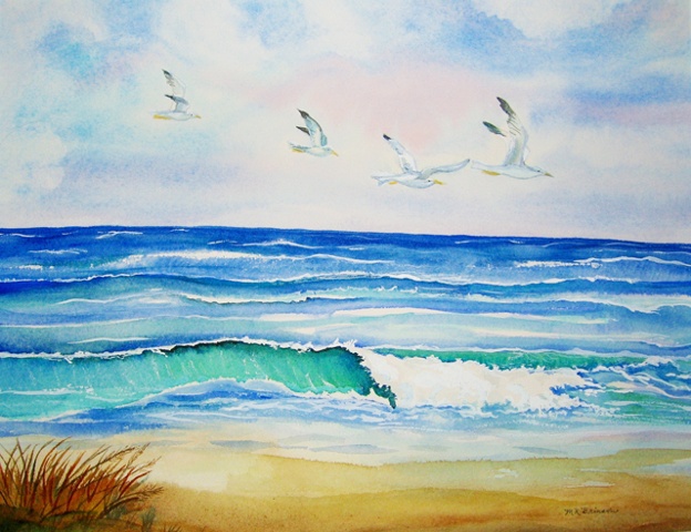 Four seagulls soaring over ocean waves in a bright blue sky.
