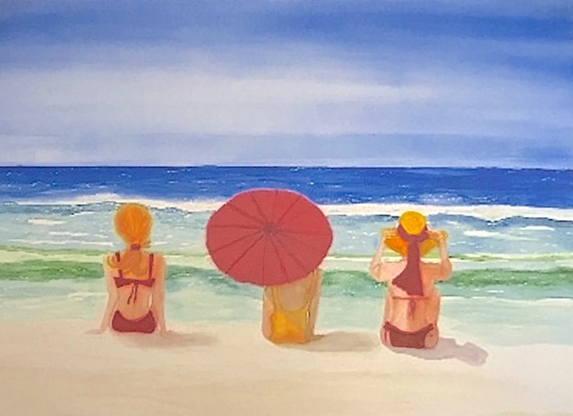 Three friend wearing red and yellow bathing suits stare at the ocean.