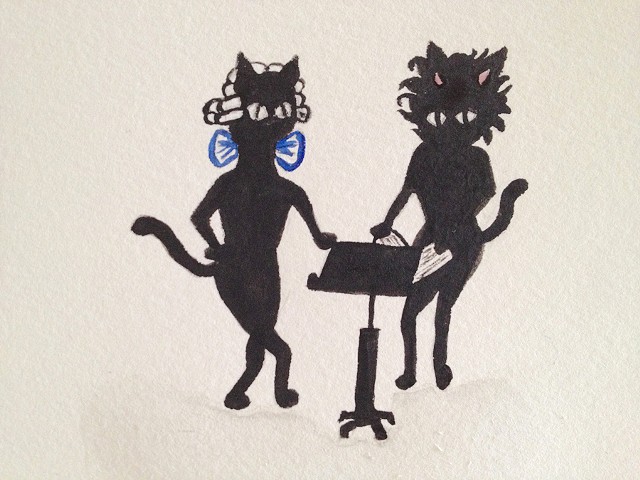 Two black cats look over some sheet music together.