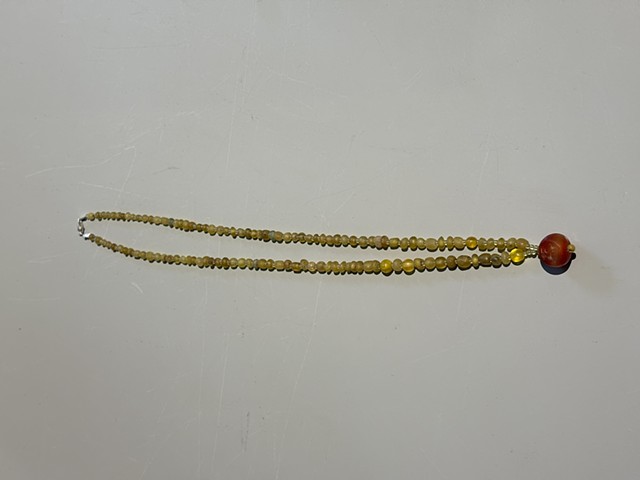Yellow Djenne beads with a Sassanian intaglio carnelian mythical tailed animal pendant (224-651 AD) (25010)