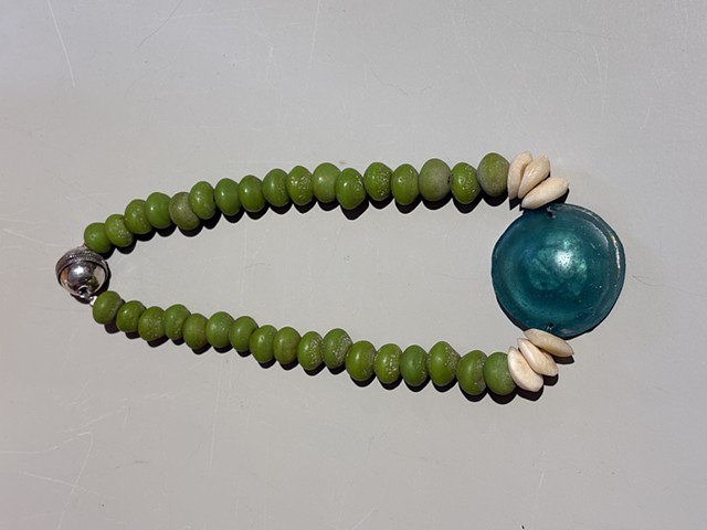 Ancient green Roman glass and white accent camel bone, paired with a recycled Javanese glass pendant (25006)