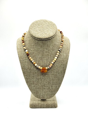 Jasper beads / a hammer carved Achaemenid 'good luck' carnelian pendant (550-330 BCE)
