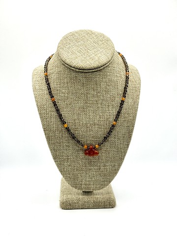 Smoky quartz, peach carnelian / Carnelian hammer carved Achaemenid 'good luck' pendant (550-330 BCE, Ancient Persia)