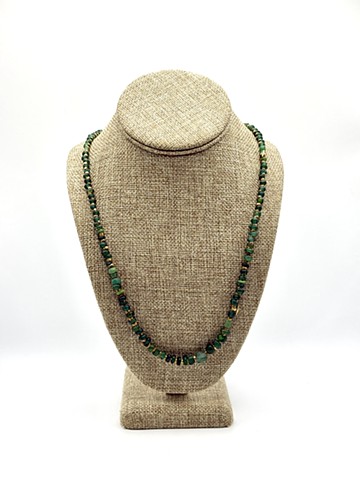 Ancient Roman green glass (+/- 400 AD, Rome), Antique handmade bronze beads (India)