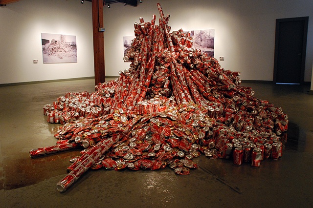 Sculpture of mountain made out of reclaimed coke cans and packing tape