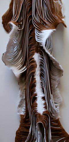 Art installation of shaved and cut cowhides and calfskins