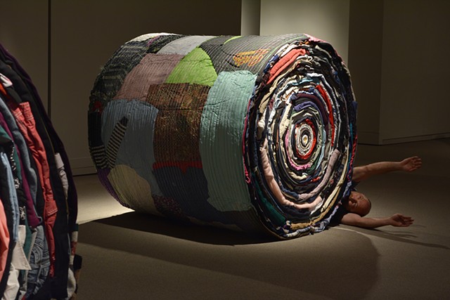 Art installation of full scale round bales made out of used clothing and bale netting