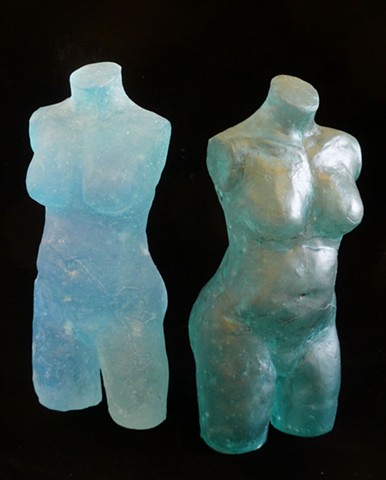 Duality expressed in dual glass sculptures of female torsos