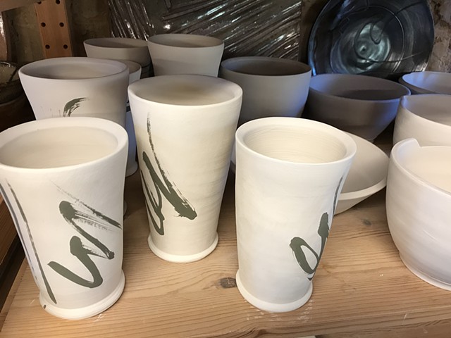 Works in progress, greenware cups drying on shelves, by Carol Naughton Ceramics