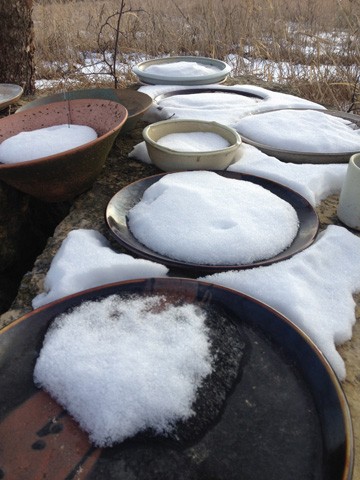 Bowls catching snow in winter outside of studio. By Carol Naughton Ceramics