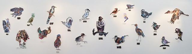 Art Installation view of 21 bird species at risk from Canada and the American registry. Each bird is made from a drawing and a collage assembled digitally and printed with archival pigment on Hahnemuhle Photo Rag, laser-cut, inserted and fastened between 