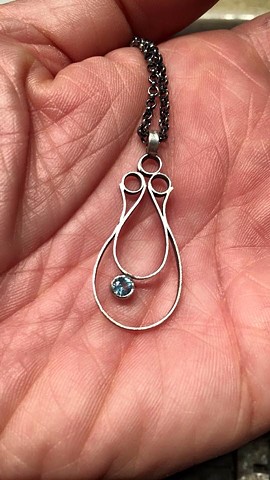 Double teardrop with three circles 