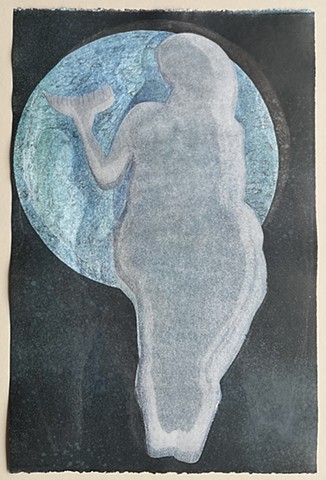Laussell figure holding horn in front of the moon