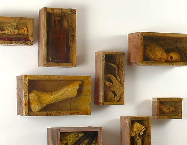 Lois Epperson-Gale, in situ (installation view), assemblage (used pallette wood, found and made objects, nails, orthochromatic film positive, shellac), 2009