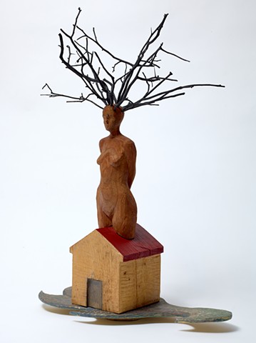 Wood sculpture by Lin Lisberger referencing Jamaica Kincaid short story