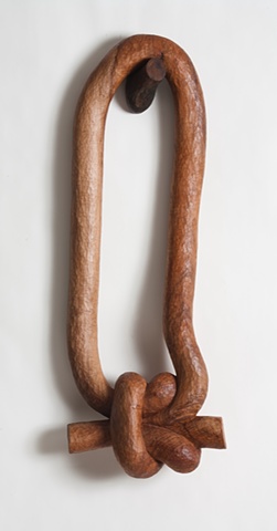 Carved wood sculpture of a knot by Lin Lisberger