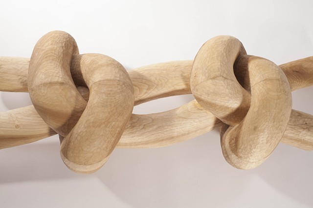 detail of large carved wood knot by Lin Lisberger