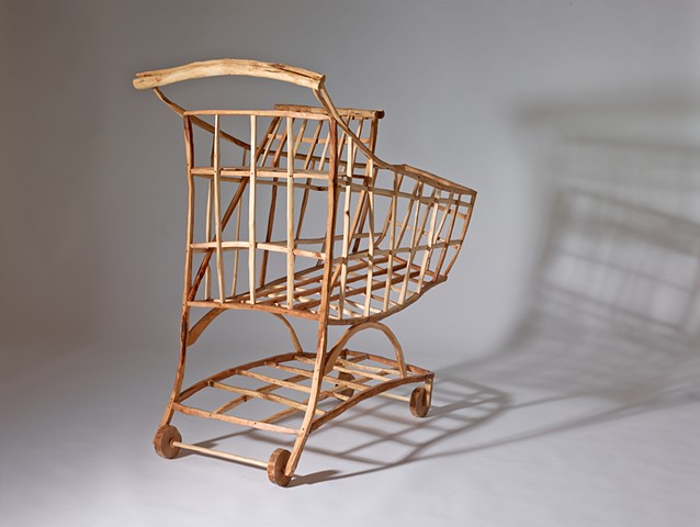 Wood sculpture by Lin Lisberger about shopping carts