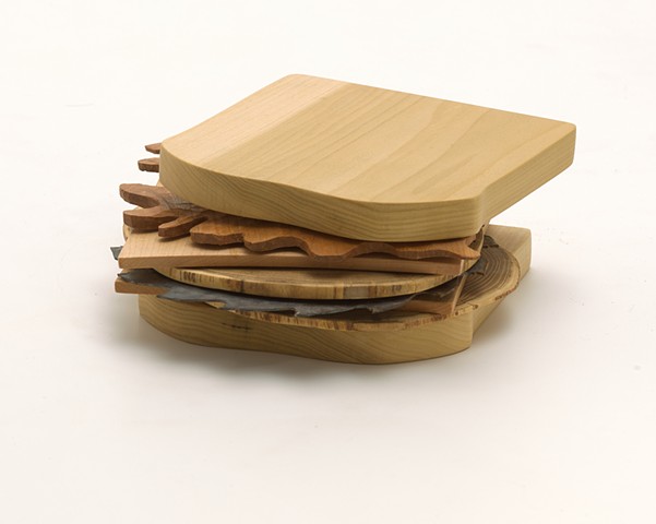 Carved wood sandwich book sculpture by Lin Lisberger