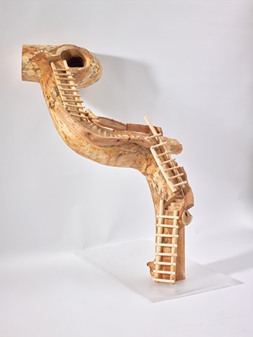 Wood sculpture by Lin Lisberger about the ladders at Bandelier National Monument