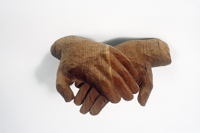 Wood sculpture of hands by Lin Lisberger