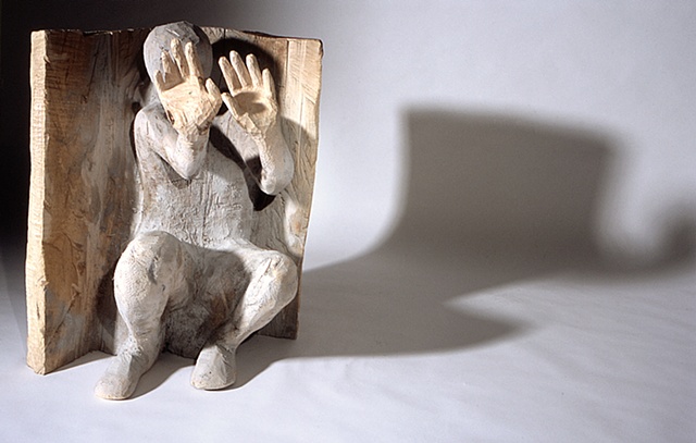 Wood sculpture about torture at Abu Ghraib by Lin Lisberger