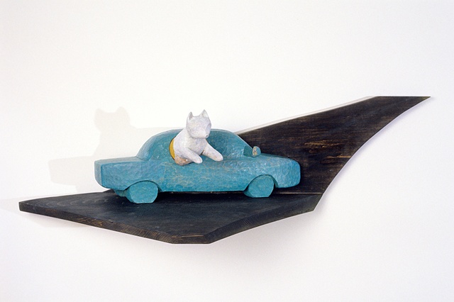 Wood sculpture about a car event by Lin Lisberger