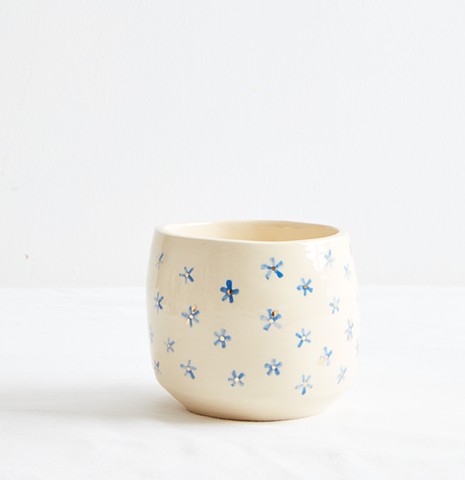 Pot with blue flowers