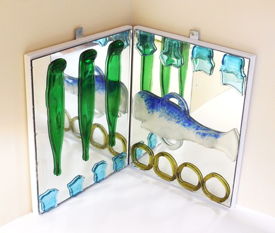 Slumped and fused bottle glass on mirrors that are on hinged plywood.   Hangs in a corner. 