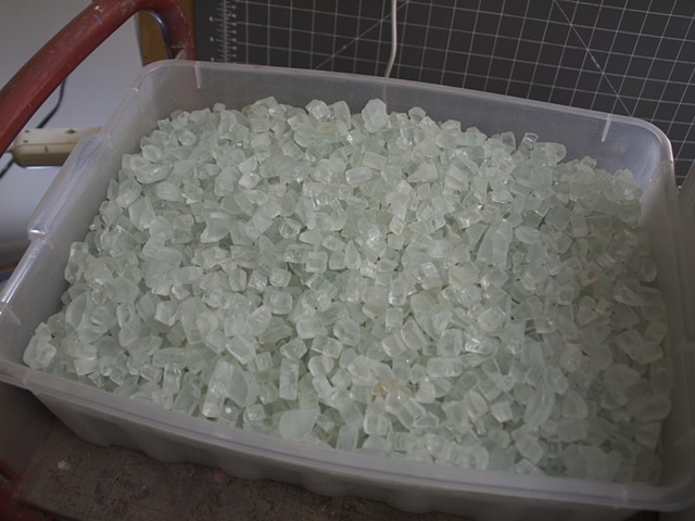 Tumbled shower door glass is washed and dried and ready to be used.