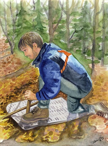 Image of young man in the woods starting a fire