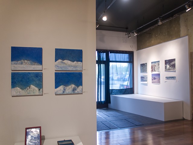 View towards front of gallery - prints on entry and small oils
