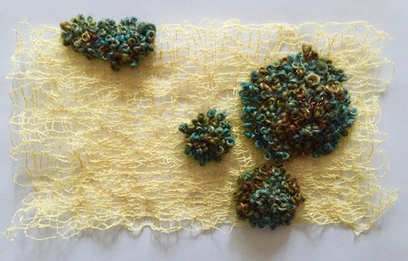 Rich, green lichen growing upon yellow lace