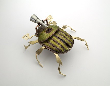 kinetic metal beetle formed by hydraulic pressing, etching, and cold connections which opens up to reveal a small folding 'fortune' with a big dipper