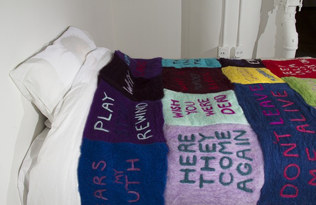 Colourful needle felt patches fiber text work installation art of my bed by illustrator and artist Bo Yoon at the School of the Art Institute of Chicago SAIC Fall BFA show