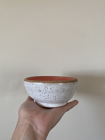 white and coral specked footed bowl