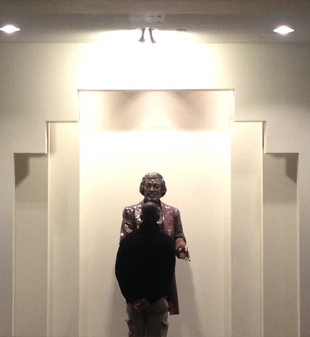 Man looking at Douglass at the Memorial Art Gallery