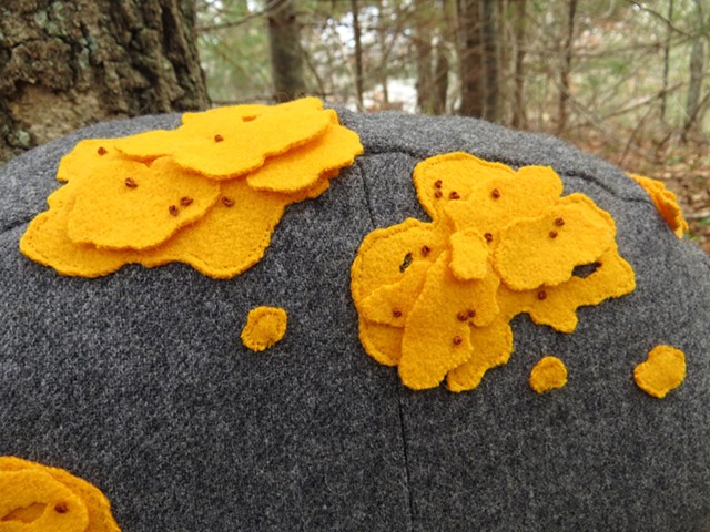 detail of yellow wool lichen on stuffed rock shaped pillow, soft sculpture, by Chelsea Clarke