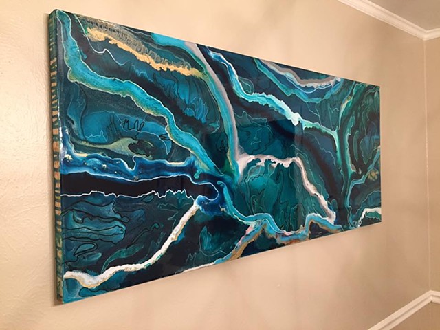 Emerald River is an original, abstract art piece by local fluid artists Suzie Collins. 