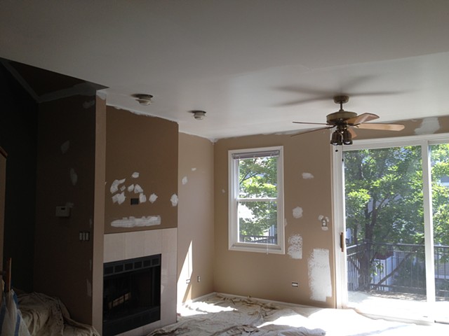 Contemporary living space prior to custom cabinet, mantle, crown moulding installation and final finishes