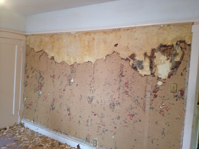 circa 1920 Craftsman master bedroom during removal of stucco-over-wallpaper-over painted wallpaper